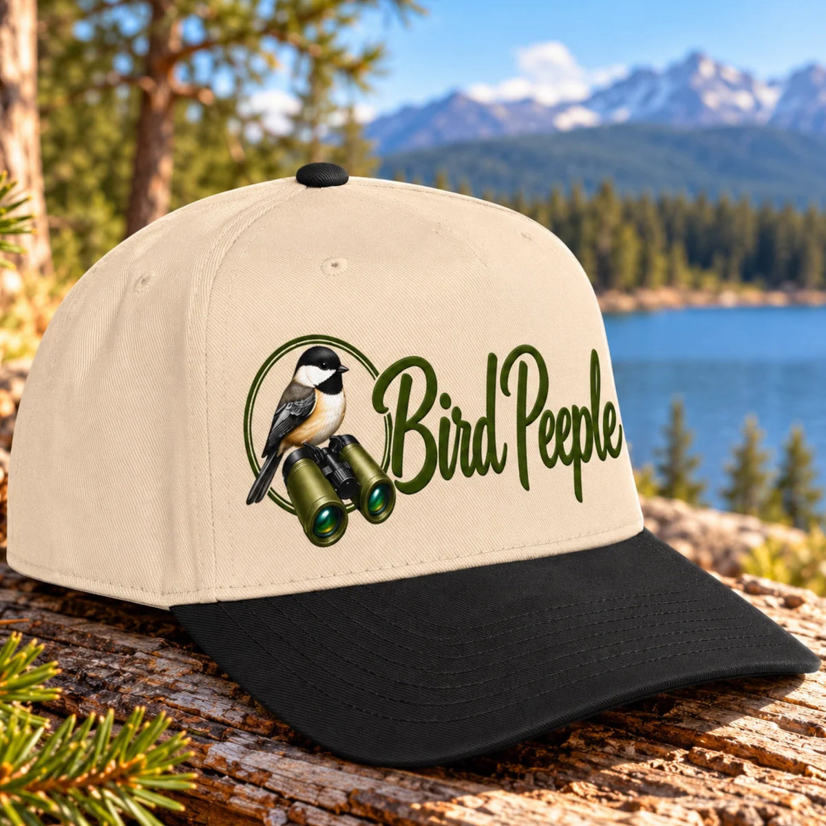 Bird Peeple Birding Hat in Black and Natural - Chickadee and binoculars logo baseball cap, angled view